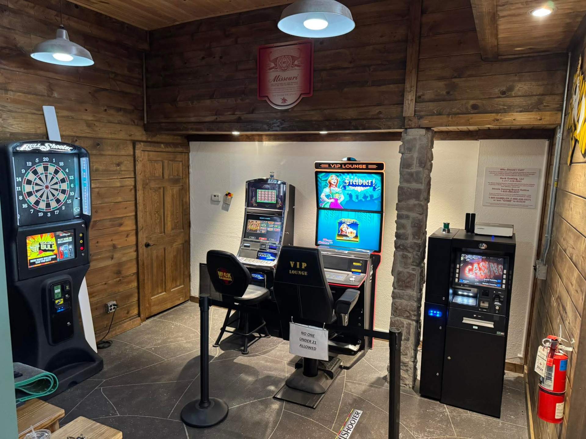 Rustic VIP Lounge with WMS slots, Bull Shooter dart machine and on-site ATM